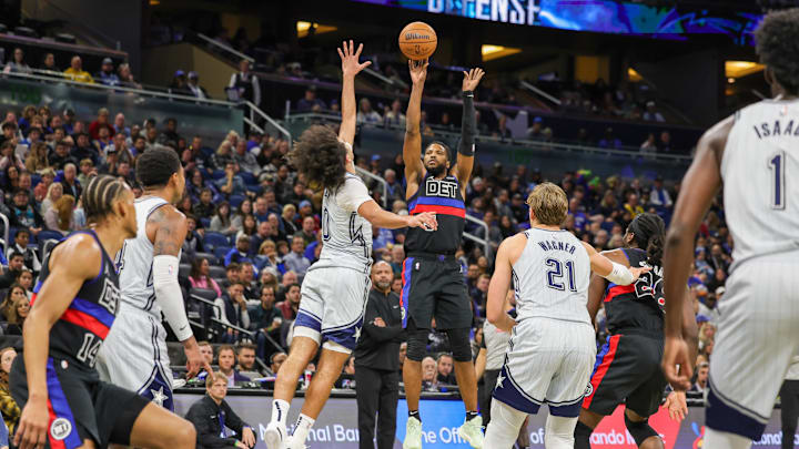 Nov 23, 2024; Orlando, Florida, USA; Detroit Pistons guard Malik Beasley (5) shoots a three point basket against Orlando Magic guard Anthony Black (0) during the second quarter at Kia Center. Mandatory Credit: Mike Watters-Imagn Images Nov 23, 2024; Orlando, Florida, USA; Detroit Pistons guard Malik Beasley (5) shoots a three point basket against Orlando Magic guard Anthony Black (0) during the second quarter at Kia Center. Mandatory Credit: Mike Watters-Imagn Images