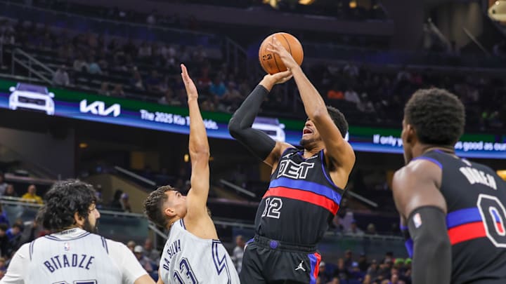 Nov 23, 2024; Orlando, Florida, USA; Detroit Pistons forward Tobias Harris (12) shoots the ball over Orlando Magic forward Tristan da Silva (23) during the first quarter at Kia Center. Mandatory Credit: Mike Watters-Imagn Images