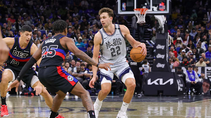 Nov 23, 2024; Orlando, Florida, USA; Orlando Magic forward Franz Wagner (22) controls the ball in front of Detroit Pistons guard Marcus Sasser (25) during the second half at Kia Center. Mandatory Credit: Mike Watters-Imagn Images