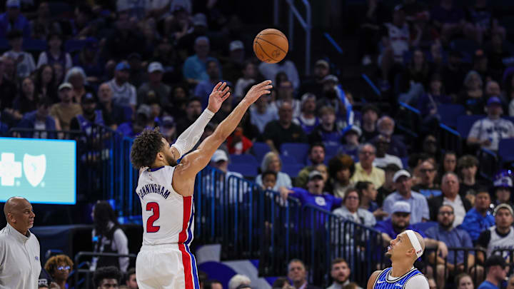 Mar 1, 2026; Orlando, Florida, USA; Detroit Pistons guard Cade Cunningham (2) shoots a three-point basket over Orlando Magic guard Jalen Suggs (4) during the second half at Kia Center. Mandatory Credit: Mike Watters-Imagn Images