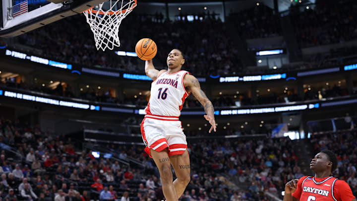 Mar 23, 2024; Salt Lake City, UT, USA; Arizona Wildcats forward Keshad Johnson (16) dunks against Dayton Flyers guard Enoch Cheeks (6) during the first half in the second round of the 2024 NCAA Tournament at Vivint Smart Home Arena-Delta Center. Mandatory Credit: Rob Gray-USA TODAY Sports Mar 23, 2024; Salt Lake City, UT, USA; Arizona Wildcats forward Keshad Johnson (16) dunks against Dayton Flyers guard Enoch Cheeks (6) during the first half in the second round of the 2024 NCAA Tournament at Vivint Smart Home Arena-Delta Center. Mandatory Credit: Rob Gray-USA TODAY Sports