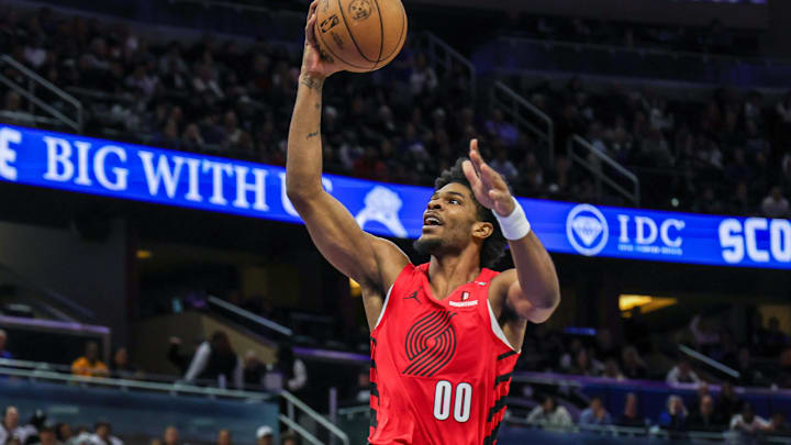 Jan 23, 2025; Orlando, Florida, USA; Portland Trail Blazers guard Scoot Henderson (00) goes to the basket during the second half against the Orlando Magic at Kia Center. Mandatory Credit: Mike Watters-Imagn Images