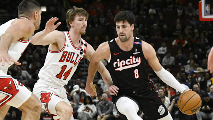 Apr 4, 2025; Chicago, Illinois, USA;  Portland Trail Blazers forward Deni Avdija (8) moves the ball against Chicago Bulls forward Matas Buzelis (14) during the first half at United Center. Mandatory Credit: Matt Marton-Imagn Images