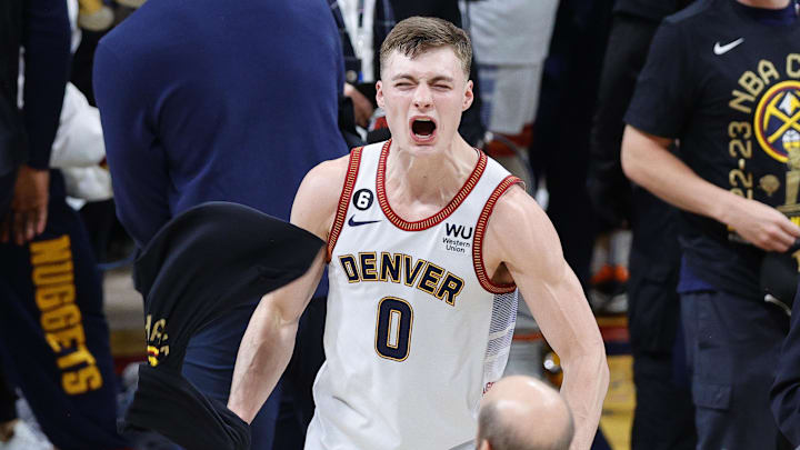 Jun 12, 2023; Denver, Colorado, USA; Denver Nuggets guard Christian Braun (0) celebrates after winning the 2023 NBA Championship against the Miami Heat at Ball Arena. Mandatory Credit: Isaiah J. Downing-Imagn Images