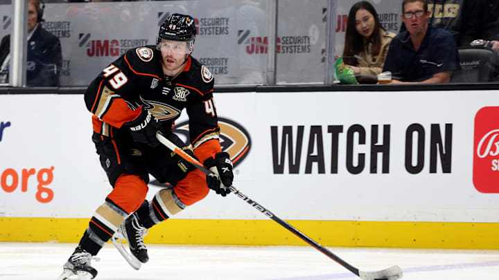 Mar 24, 2024; Anaheim, California, USA; Anaheim Ducks left wing Max Jones (49) skates with the puck during the second period against the Tampa Bay Lightning at Honda Center. Mandatory Credit: Jason Parkhurst-Imagn Images