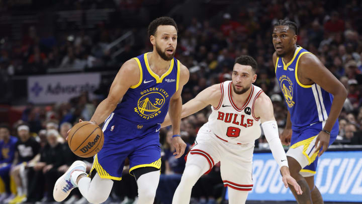 Jan 12, 2024; Chicago, Illinois, USA; Golden State Warriors guard Stephen Curry (30) dribbles against Chicago Bulls guard Zach LaVine (8) during the first half at United Center. Mandatory Credit: Kamil Krzaczynski-USA TODAY Sports