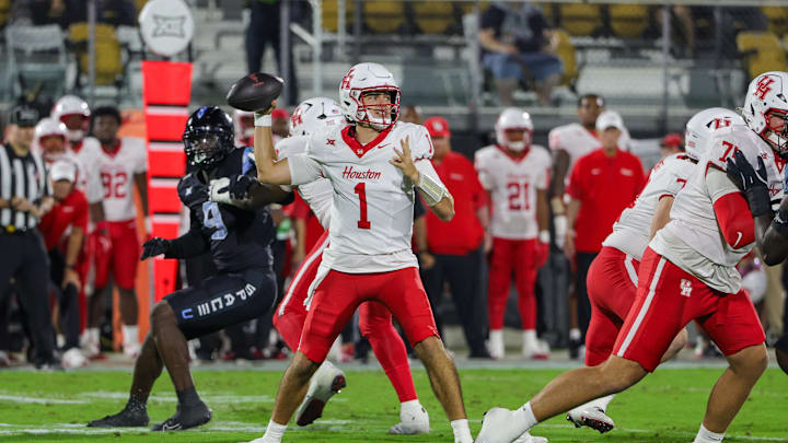Nov 7, 2025; Orlando, Florida, USA; Houston Cougars quarterback Conner Weigman (1) drops back to pass during the first quarter against the UCF Knights at Acrisure Bounce House. Mandatory Credit: Mike Watters-Imagn Images