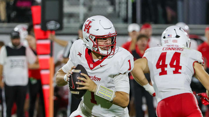 Nov 7, 2025; Orlando, Florida, USA; Houston Cougars quarterback Conner Weigman (1) looks to pass during the first quarter against the UCF Knights at Acrisure Bounce House. Mandatory Credit: Mike Watters-Imagn Images