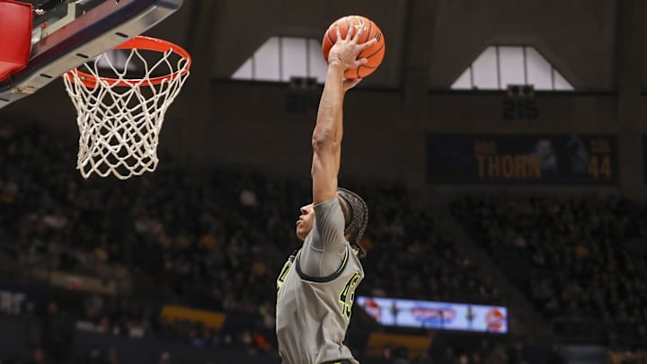 Jan 31, 2026; Morgantown, West Virginia, USA; Baylor Bears guard Cameron Carr (43) dunks the ball during the first half against the West Virginia Mountaineers at Hope Coliseum. Mandatory Credit: Ben Queen-Imagn Images