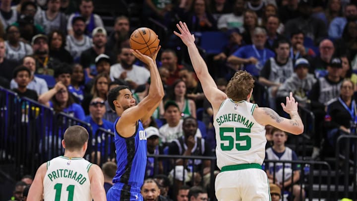 Apr 9, 2025; Orlando, Florida, USA; Orlando Magic guard Caleb Houstan (2) shoots in front of Boston Celtics forward Baylor Scheierman (55) during the second quarter at Kia Center. Mandatory Credit: Mike Watters-Imagn Images