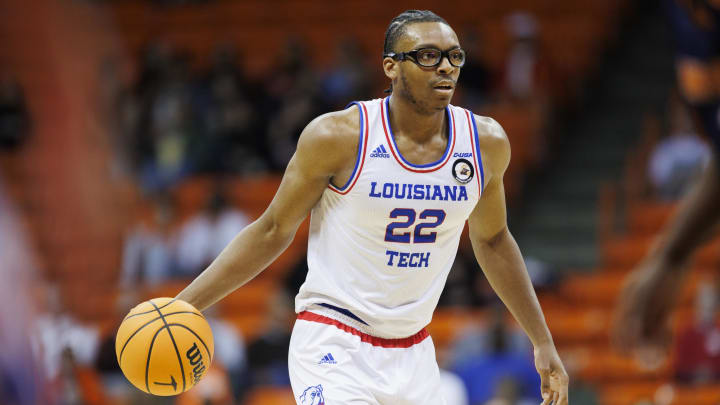 Feb 22, 2024; El Paso, Texas, USA; LA Tech Bulldogs Aggies forward Isaiah Crawford (22) dribbles the ball against the UTEP Miners defense in the first half at Don Haskins Center. Mandatory Credit: Ivan Pierre Aguirre-USA TODAY Sports