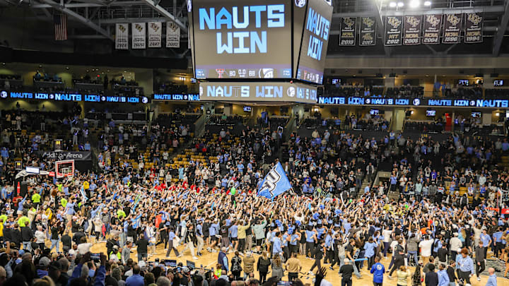 Jan 31, 2026; Orlando, Florida, USA; UCF Knights fans storm the court after winning against Texas Tech Red Raiders during the second half at Addition Financial Arena. Mandatory Credit: Mike Watters-Imagn Images