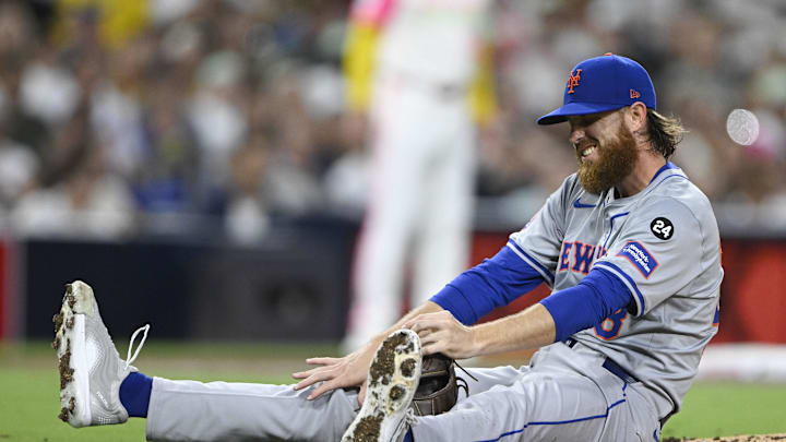 Aug 23, 2024; San Diego, California, USA; New York Mets starting pitcher Paul Blackburn (58) reacts after being hit during the third inning against the San Diego Padres at Petco Park. Mandatory Credit: Denis Poroy-Imagn Images