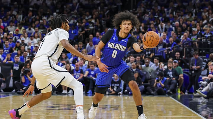 Oct 25, 2024; Orlando, Florida, USA; Orlando Magic guard Anthony Black (0) passes the ball around Brooklyn Nets forward Ziaire Williams (1) during the second half at Kia Center. Mandatory Credit: Mike Watters-Imagn Images Oct 25, 2024; Orlando, Florida, USA; Orlando Magic guard Anthony Black (0) passes the ball around Brooklyn Nets forward Ziaire Williams (1) during the second half at Kia Center. Mandatory Credit: Mike Watters-Imagn Images
