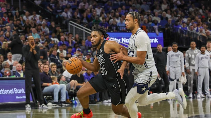 Dec 29, 2024; Orlando, Florida, USA; Brooklyn Nets guard Cam Thomas (24) drives to the basket against Orlando Magic guard Jett Howard (13) during the second quarter at Kia Center. Mandatory Credit: Mike Watters-Imagn Images