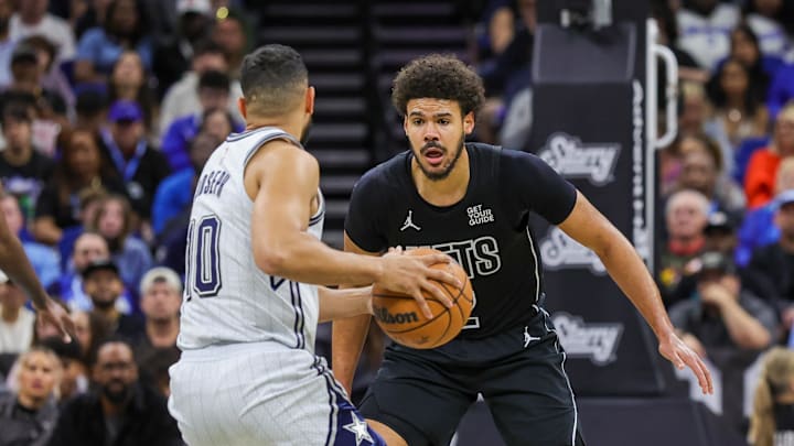 Dec 29, 2024; Orlando, Florida, USA; Brooklyn Nets forward Cameron Johnson (2) defends Orlando Magic guard Cory Joseph (10) during the second quarter at Kia Center. Mandatory Credit: Mike Watters-Imagn Images
