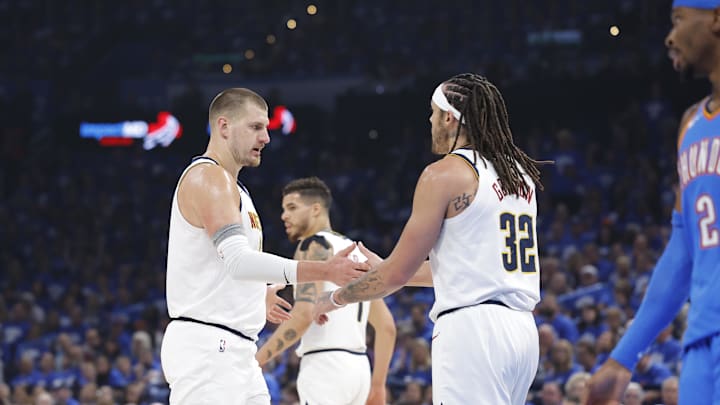 May 18, 2025; Oklahoma City, Oklahoma, USA; Denver Nuggets center Nikola Jokic (15) and Denver Nuggets forward Aaron Gordon (32) celebrate after a play against the Oklahoma City Thunder in the first quarter during game seven of the second round for the 2025 NBA Playoffs at Paycom Center. Mandatory Credit: Alonzo Adams-Imagn Images