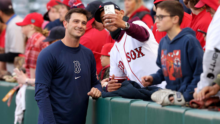 Apr 5, 2024; Anaheim, California, USA; Boston Red Sox pitcher Garrett Whitlock (22) takes a picture with a fan before a game against the Los Angeles Angels at Angel Stadium. Mandatory Credit: Jason Parkhurst-Imagn Images Apr 5, 2024; Anaheim, California, USA; Boston Red Sox pitcher Garrett Whitlock (22) takes a picture with a fan before a game against the Los Angeles Angels at Angel Stadium. Mandatory Credit: Jason Parkhurst-Imagn Images