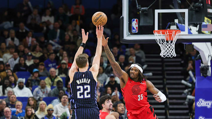 Jan 23, 2025; Orlando, Florida, USA; Orlando Magic forward Franz Wagner (22) shoots against Portland Trail Blazers center Robert Williams III (35) during the second half at Kia Center. Mandatory Credit: Mike Watters-Imagn Images