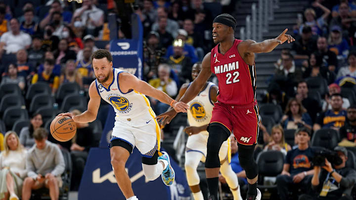 Oct 27, 2022; San Francisco, California, USA; Golden State Warriors guard Stephen Curry (30) dribbles past Miami Heat forward Jimmy Butler (22) in the third quarter at the Chase Center. Mandatory Credit: Cary Edmondson-Imagn Images