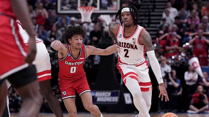 Mar 23, 2024; Salt Lake City, UT, USA; Arizona Wildcats guard Caleb Love (2) drives against Dayton Flyers guard Javon Bennett (0) during the second half in the second round of the 2024 NCAA Tournament at Vivint Smart Home Arena-Delta Center. 