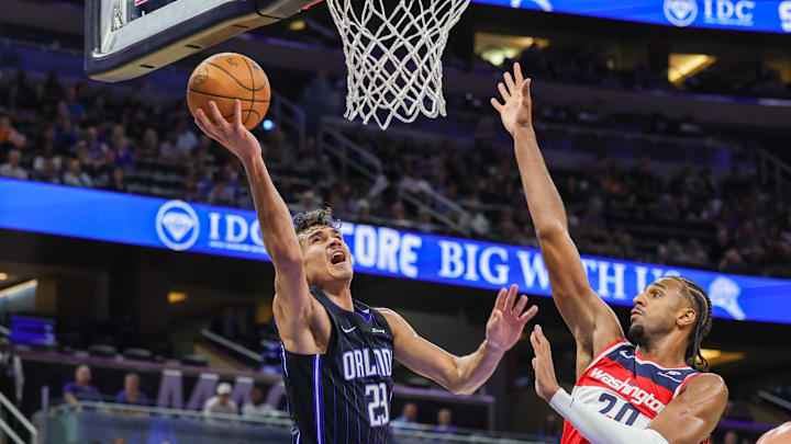 Nov 10, 2024; Orlando, Florida, USA; Orlando Magic forward Tristan da Silva (23) goes to the basket against Washington Wizards forward Alexandre Sarr (20) during the second half at Kia Center. Mandatory Credit: Mike Watters-Imagn Images