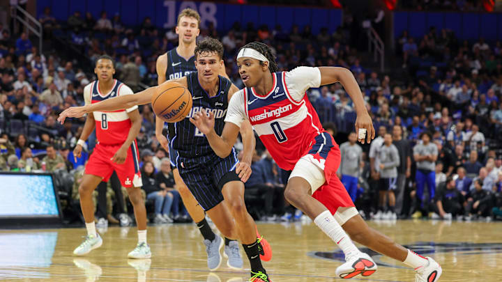 Nov 10, 2024; Orlando, Florida, USA; Washington Wizards guard Bilal Coulibaly (0) drives to the basket around Orlando Magic forward Tristan da Silva (23) during the second quarter at Kia Center. Mandatory Credit: Mike Watters-Imagn Images