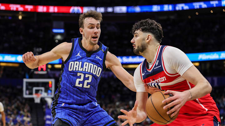 Feb 23, 2025; Orlando, Florida, USA; Orlando Magic forward Franz Wagner (22) defends Washington Wizards forward Tristan Vukcevic (00) during the second quarter at Kia Center. Mandatory Credit: Mike Watters-Imagn Images