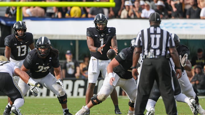 Sep 28, 2024; Orlando, Florida, USA; UCF Knights quarterback KJ Jefferson (1) receives the snap against the Colorado Buffaloes during the second quarter at FBC Mortgage Stadium. Mandatory Credit: Mike Watters-Imagn Images