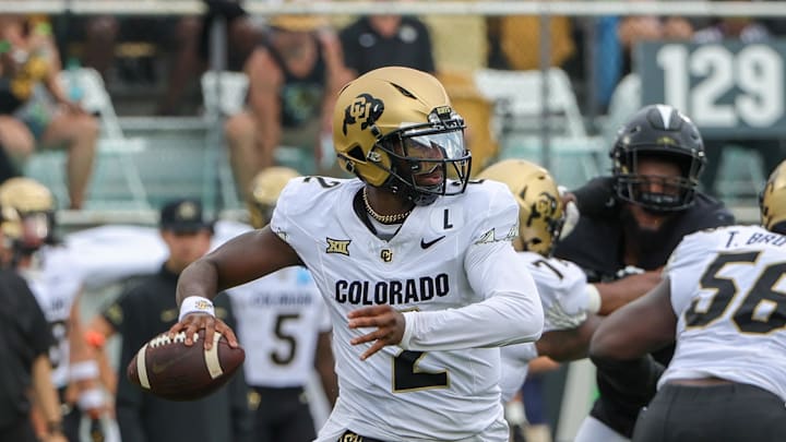 Sep 28, 2024; Orlando, Florida, USA; Colorado Buffaloes quarterback Shedeur Sanders (2) rolls out to pass against the UCF Knights during the first quarter at FBC Mortgage Stadium. Mandatory Credit: Mike Watters-Imagn Images Sep 28, 2024; Orlando, Florida, USA; Colorado Buffaloes quarterback Shedeur Sanders (2) rolls out to pass against the UCF Knights during the first quarter at FBC Mortgage Stadium. Mandatory Credit: Mike Watters-Imagn Images