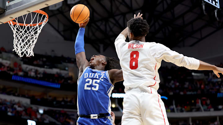 Mar 29, 2024; Dallas, TX, USA; Duke Blue Devils forward Mark Mitchell (25) dunks against Houston Cougars guard Mylik Wilson (8) during the second half in the semifinals of the South Regional of the 2024 NCAA Tournament at American Airlines Center. Mandatory Credit: Tim Heitman-Imagn Images Mar 29, 2024; Dallas, TX, USA; Duke Blue Devils forward Mark Mitchell (25) dunks against Houston Cougars guard Mylik Wilson (8) during the second half in the semifinals of the South Regional of the 2024 NCAA Tournament at American Airlines Center. Mandatory Credit: Tim Heitman-Imagn Images