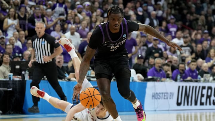 Mar 22, 2024; Spokane, WA, USA; Grand Canyon Antelopes guard Tyon Grant-Foster (7) beats St. Mary's Gaels guard Alex Ducas (44) to a loose ball during the first half in the first round of the 2024 NCAA Tournament at Spokane Veterans Memorial Arena. Mandatory Credit: Kirby Lee-Imagn Images 