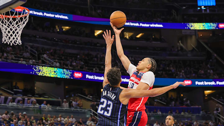 Nov 10, 2024; Orlando, Florida, USA; Washington Wizards forward Kyshawn George (18) goes to the basket against Orlando Magic forward Tristan da Silva (23) during the second quarter at Kia Center. Mandatory Credit: Mike Watters-Imagn Images