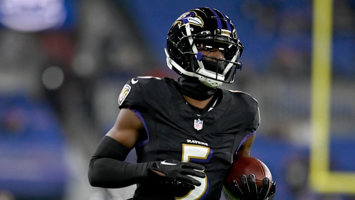 Nov 16, 2023; Baltimore, Maryland, USA; Baltimore Ravens cornerback Jalyn Armour-Davis (5) warms up before a game against the Cincinnati Bengals at M&T Bank Stadium. Mandatory Credit: Tommy Gilligan-Imagn Images