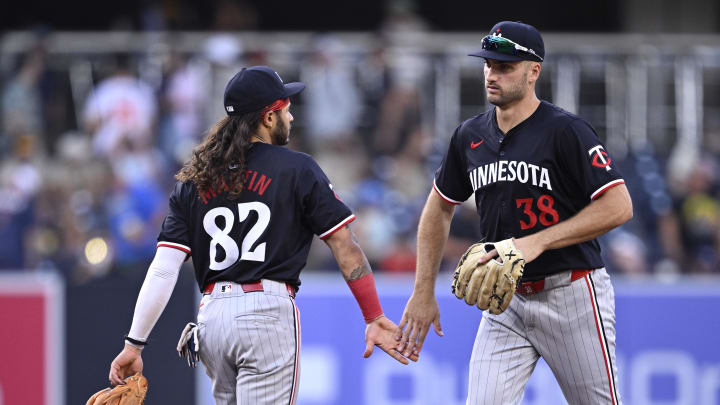 Aug 21, 2024; San Diego, California, USA; Minnesota Twins right fielder Matt Wallner (38) and left fielder Austin Martin (82) celebrate on the field after defeating the San Diego Padres at Petco Park. Aug 21, 2024; San Diego, California, USA; Minnesota Twins right fielder Matt Wallner (38) and left fielder Austin Martin (82) celebrate on the field after defeating the San Diego Padres at Petco Park.