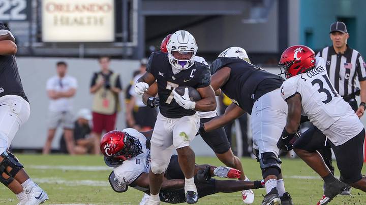 Oct 12, 2024; Orlando, Florida, USA; UCF Knights running back RJ Harvey (7) carries the ball during the second half against the Cincinnati Bearcats at FBC Mortgage Stadium. Mandatory Credit: Mike Watters-Imagn Images