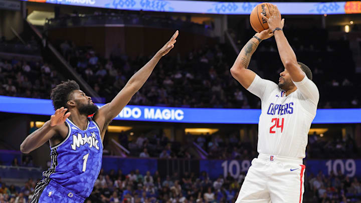 LA Clippers guard Norman Powell (24) shoots the ball against Orlando Magic forward Jonathan Isaac (1) during the second half at KIA Center.