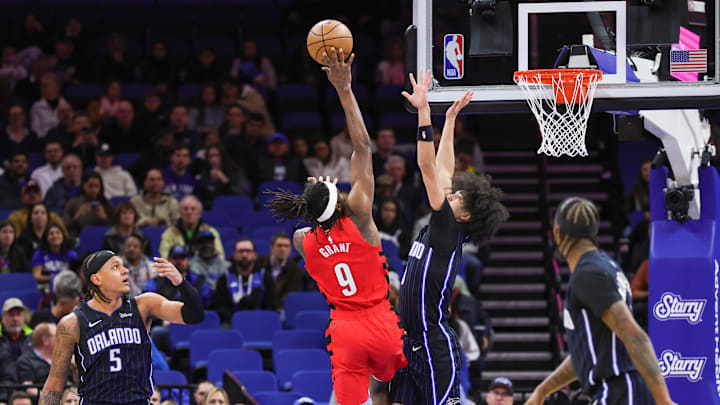 Portland Trail Blazers forward Jerami Grant (9) goes to the basket against Orlando Magic guard Anthony Black (0) during the first quarter at Kia Center.