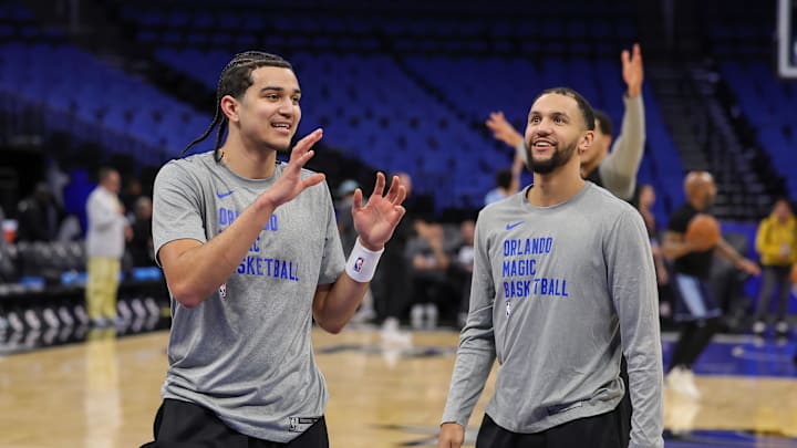 Mar 30, 2024; Orlando, Florida, USA; Orlando Magic guard Anthony Black (0) and Orlando Magic guard Jalen Suggs (4) warm up before the game against the Memphis Grizzlies at KIA Center. Mandatory Credit: Mike Watters-Imagn Images Mar 30, 2024; Orlando, Florida, USA; Orlando Magic guard Anthony Black (0) and Orlando Magic guard Jalen Suggs (4) warm up before the game against the Memphis Grizzlies at KIA Center. Mandatory Credit: Mike Watters-Imagn Images