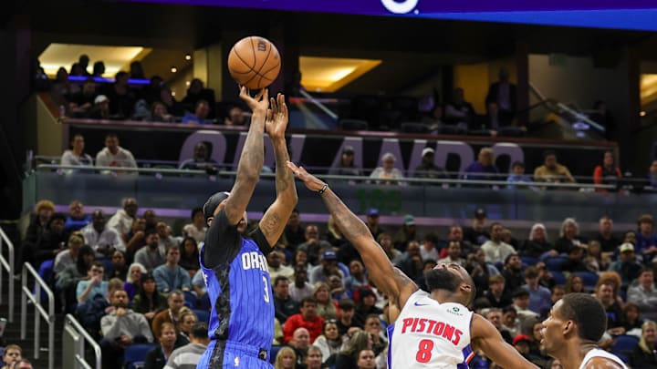 Orlando Magic guard Kentavious Caldwell-Pope shoots a three point basket against Detroit Pistons forward Tim Hardaway Jr.
