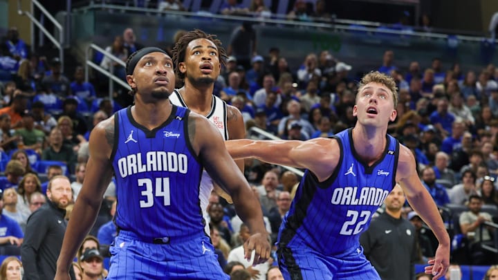Oct 25, 2024; Orlando, Florida, USA; Orlando Magic center Wendell Carter Jr. (34), forward Franz Wagner (22) and Brooklyn Nets center Nic Claxton (33) watch for the rebound during the second quarter at Kia Center. Mandatory Credit: Mike Watters-Imagn Images Oct 25, 2024; Orlando, Florida, USA; Orlando Magic center Wendell Carter Jr. (34), forward Franz Wagner (22) and Brooklyn Nets center Nic Claxton (33) watch for the rebound during the second quarter at Kia Center. Mandatory Credit: Mike Watters-Imagn Images