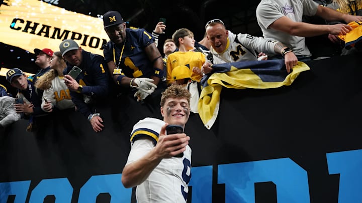 Dec 2, 2023; Indianapolis, IN, USA; Michigan Wolverines quarterback J.J. McCarthy (9) celebrates after winning the Big Ten Championship game against the Iowa Hawkeyes at Lucas Oil Stadium. Mandatory Credit: Robert Goddin-Imagn Images