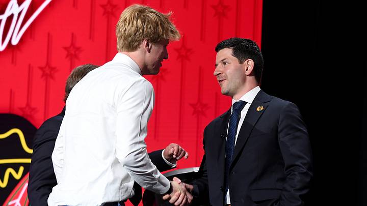 Jun 28, 2023; Nashville, Tennessee, USA; Chicago Blackhawks draft pick Oliver Moore shakes hands with general manager Kyle Davidson after being selected with the nineteenth pick in round one of the 2023 NHL Draft at Bridgestone Arena. Mandatory Credit: Christopher Hanewinckel-USA TODAY Sports