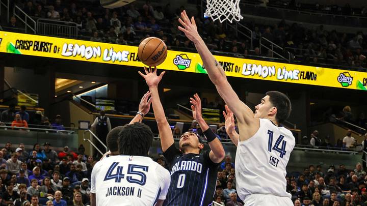 Feb 21, 2025; Orlando, Florida, USA; Orlando Magic guard Anthony Black (0) shoots against Memphis Grizzlies center Zach Edey (14) during the second quarter at Kia Center. Mandatory Credit: Mike Watters-Imagn Images Feb 21, 2025; Orlando, Florida, USA; Orlando Magic guard Anthony Black (0) shoots against Memphis Grizzlies center Zach Edey (14) during the second quarter at Kia Center. Mandatory Credit: Mike Watters-Imagn Images