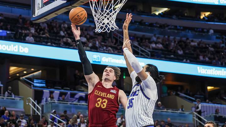 Oct 13, 2026; Orlando, Florida, USA; Cleveland Cavaliers forward Mario Hezonja (33) goes to the basket against Orlando Magic center Goga Bitadze (35) during the second half at Kia Center. Mandatory Credit: Mike Watters-Imagn Images Oct 13, 2026; Orlando, Florida, USA; Cleveland Cavaliers forward Mario Hezonja (33) goes to the basket against Orlando Magic center Goga Bitadze (35) during the second half at Kia Center. Mandatory Credit: Mike Watters-Imagn Images