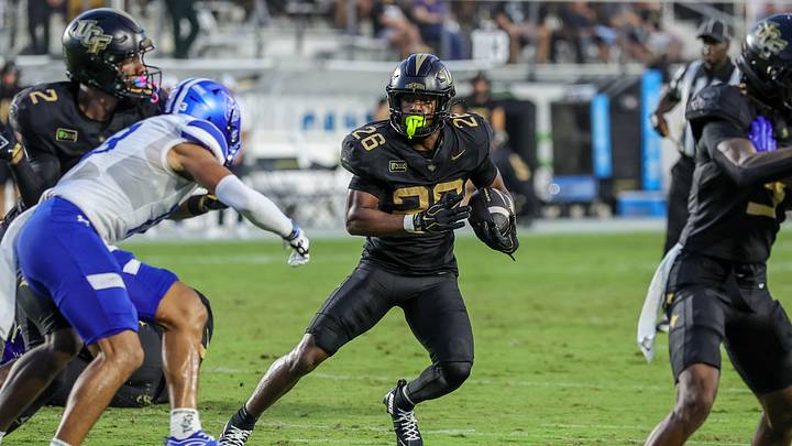 Sep 19, 2026; Orlando, Florida, USA; UCF Knights running back Duke Watson (26) carries the ball during the first quarter against the Georgia State Panthers at Acrisure Bounce House. Mandatory Credit: Mike Watters-Imagn Images Sep 19, 2026; Orlando, Florida, USA; UCF Knights running back Duke Watson (26) carries the ball during the first quarter against the Georgia State Panthers at Acrisure Bounce House. Mandatory Credit: Mike Watters-Imagn Images
