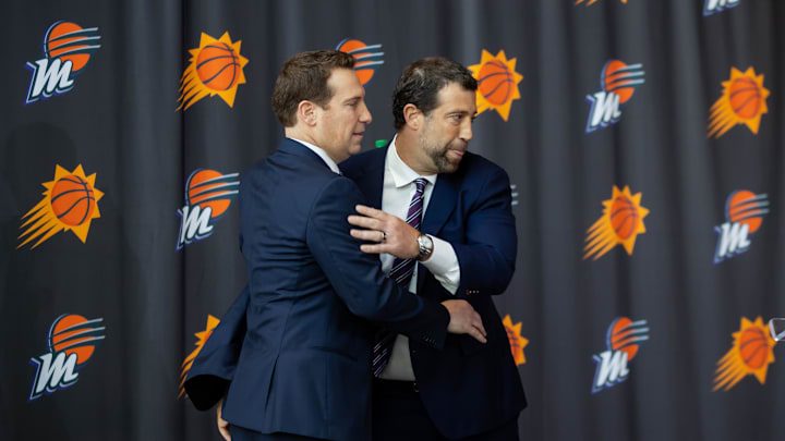 Feb 8, 2023; Phoenix, AZ, USA; Phoenix Suns owner Mat Ishbia (left) and brother Justin Ishbia hug during an introductory press conference at Footprint Center. Mandatory Credit: Mark J. Rebilas-Imagn Images