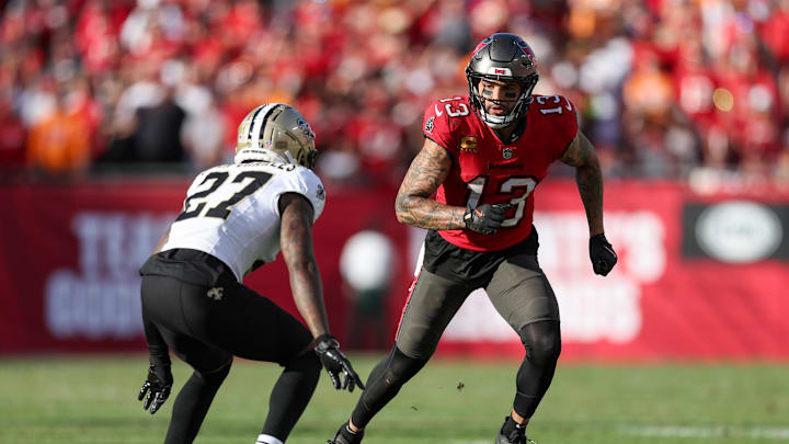Jan 5, 2025; Tampa, Florida, USA; Tampa Bay Buccaneers wide receiver Mike Evans (13) runs a route guarded by New Orleans Saints cornerback Shemar Jean-Charles (27) in the fourth quarter at Raymond James Stadium. Mandatory Credit: Nathan Ray Seebeck-Imagn Images
