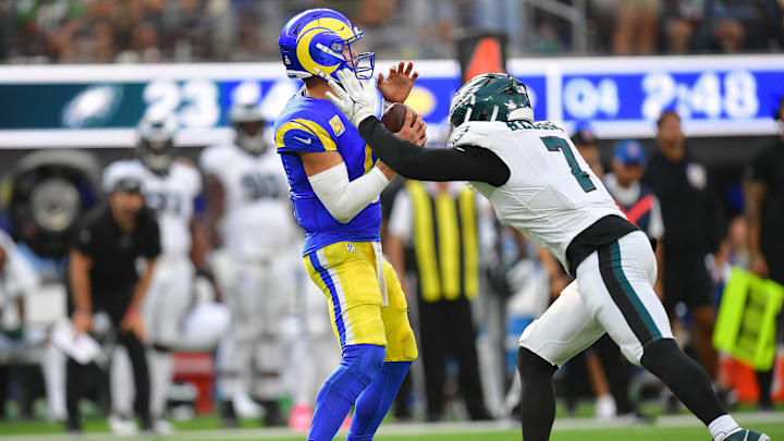 Oct 8, 2023; Inglewood, California, USA; Los Angeles Rams quarterback Matthew Stafford (9) is sacked by Philadelphia Eagles linebacker Haason Reddick (7) during the second half at SoFi Stadium. Mandatory Credit: Gary A. Vasquez-Imagn Images