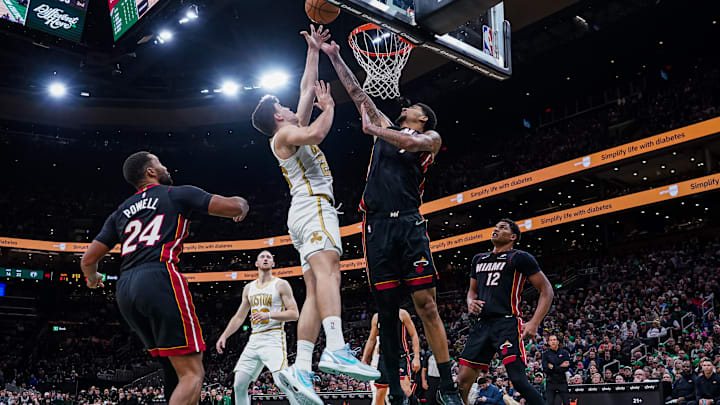 Dec 19, 2025; Boston, Massachusetts, USA; Boston Celtics guard Hugo Gonzalez (28) shoots the ball against Miami Heat center Kel'El Ware (7) in the second half at TD Garden. Mandatory Credit: David Butler II-Imagn Images